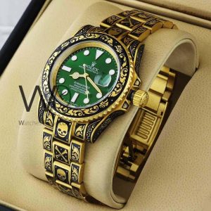 ساعه من rolex تعمل بعدادات بلون اخضر وسير دهبى &اسود  من المعدن