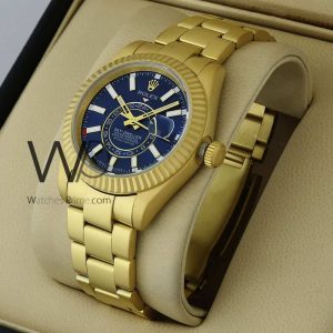 ساعه من rolex تعمل بعدادات بلون ازرق وسير دهبى من المعدن