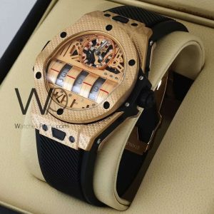 ساعه من Hublot تعمل بعدادات بلون نحاسى وسير اسود من المطاط