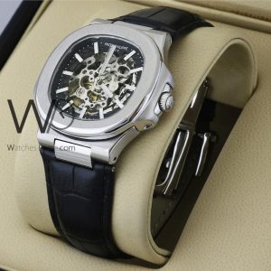 Patek Philippe leather-strap watch with a bold black belt